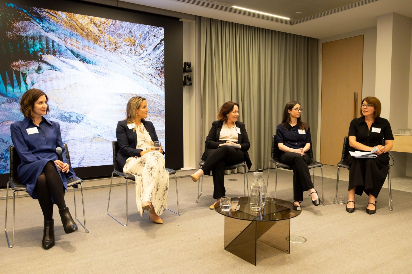 A panel of five women discussing the Impact of AI